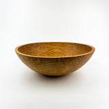Wooden bowl on a white background