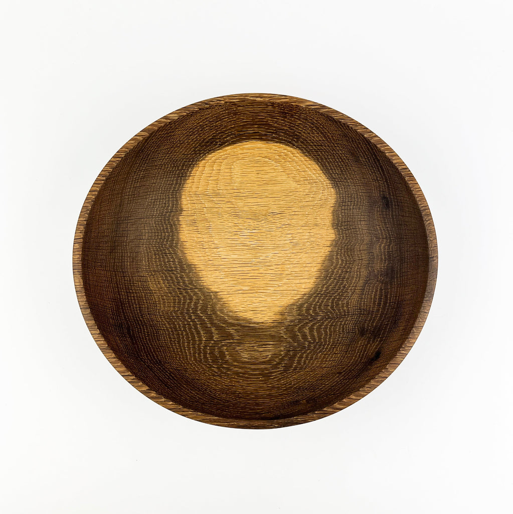 Wooden bowl with a textured surface on a white background