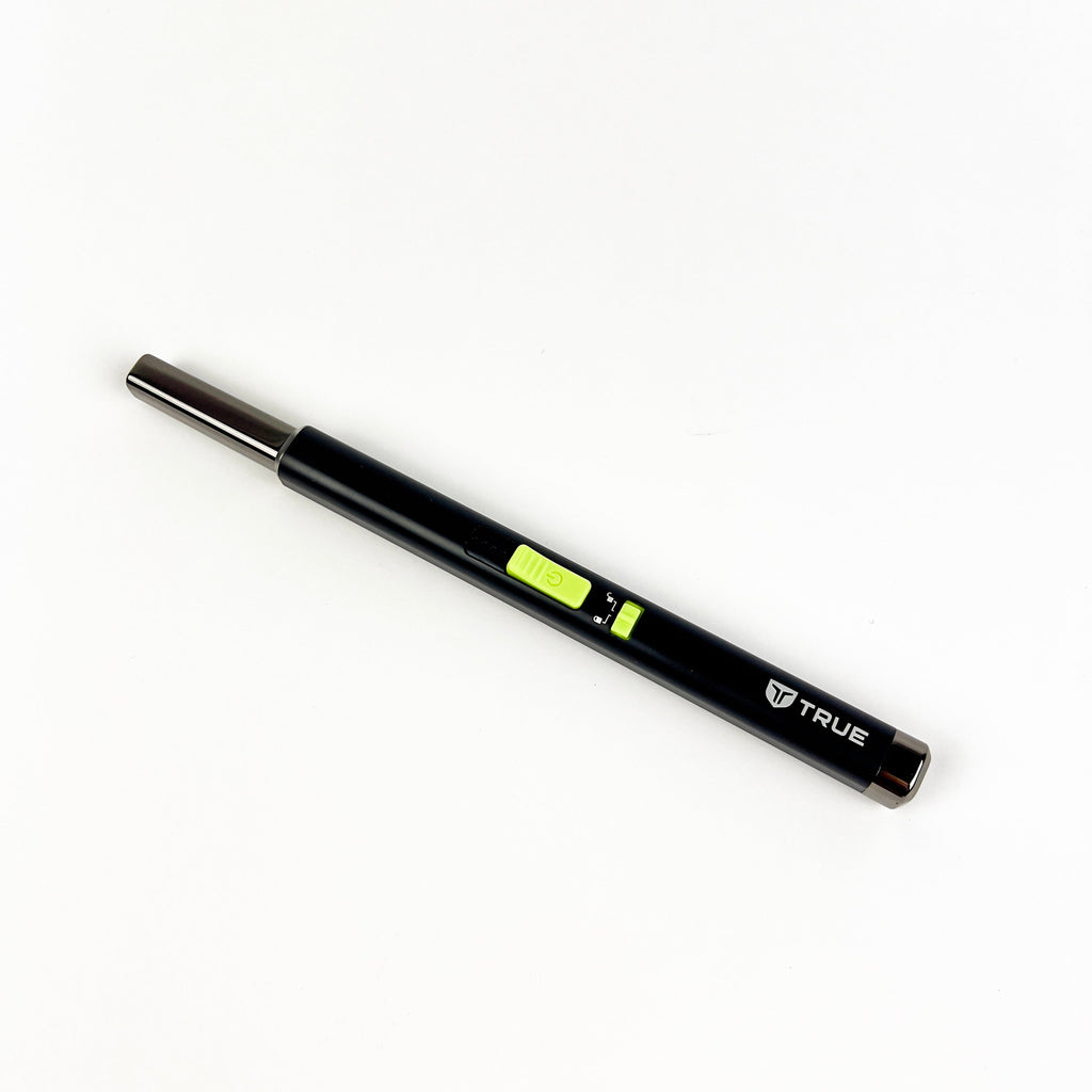 Black wand lighter with a green indicator on a white background
