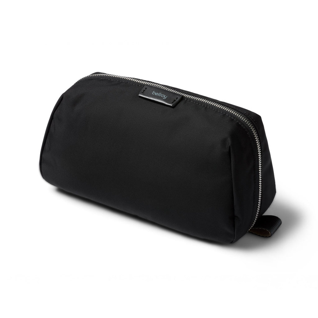 Black toiletry bag with a visible brand logo on a white background