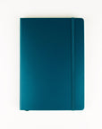 A teal blue hardcover notebook with a matching elastic closure band, photographed flat against a clean white background.
