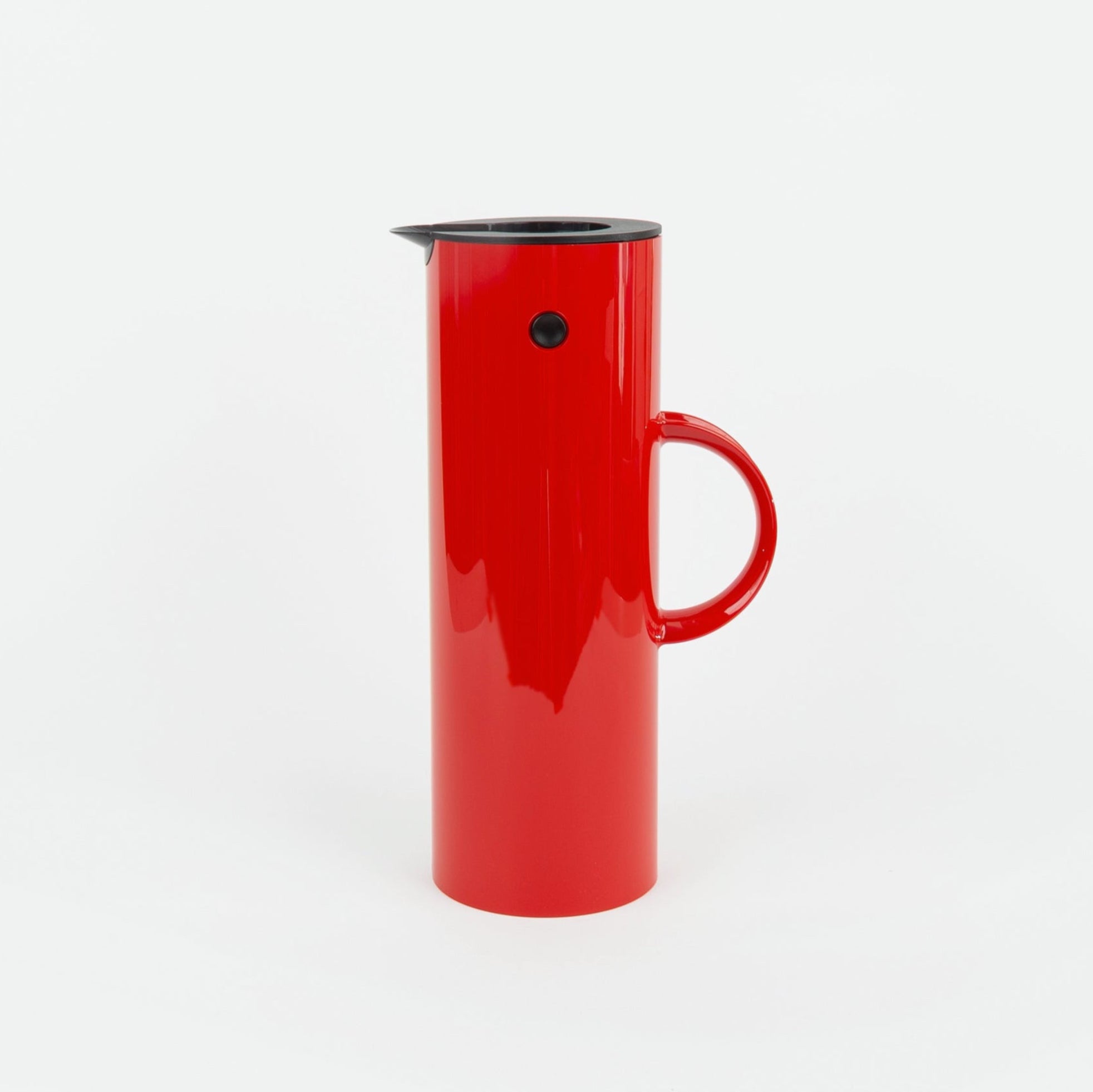 Red plastic thermal pitcher on a white background