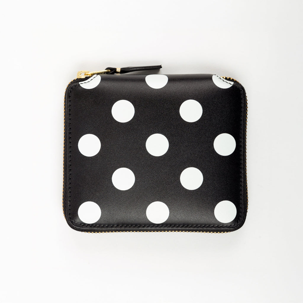 Black wallet with white polka dots on a white background