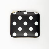Black wallet with white polka dots on a white background