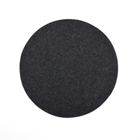 Charcoal round felt placemat on a white background