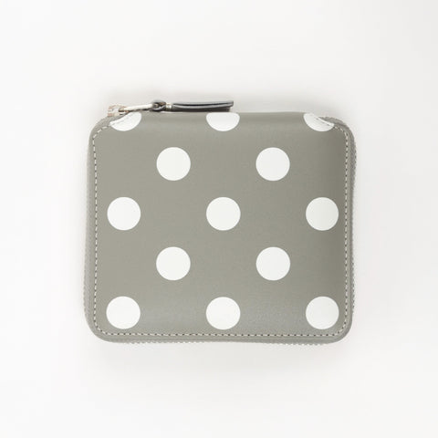 Gray wallet with white polka dots on a white background
