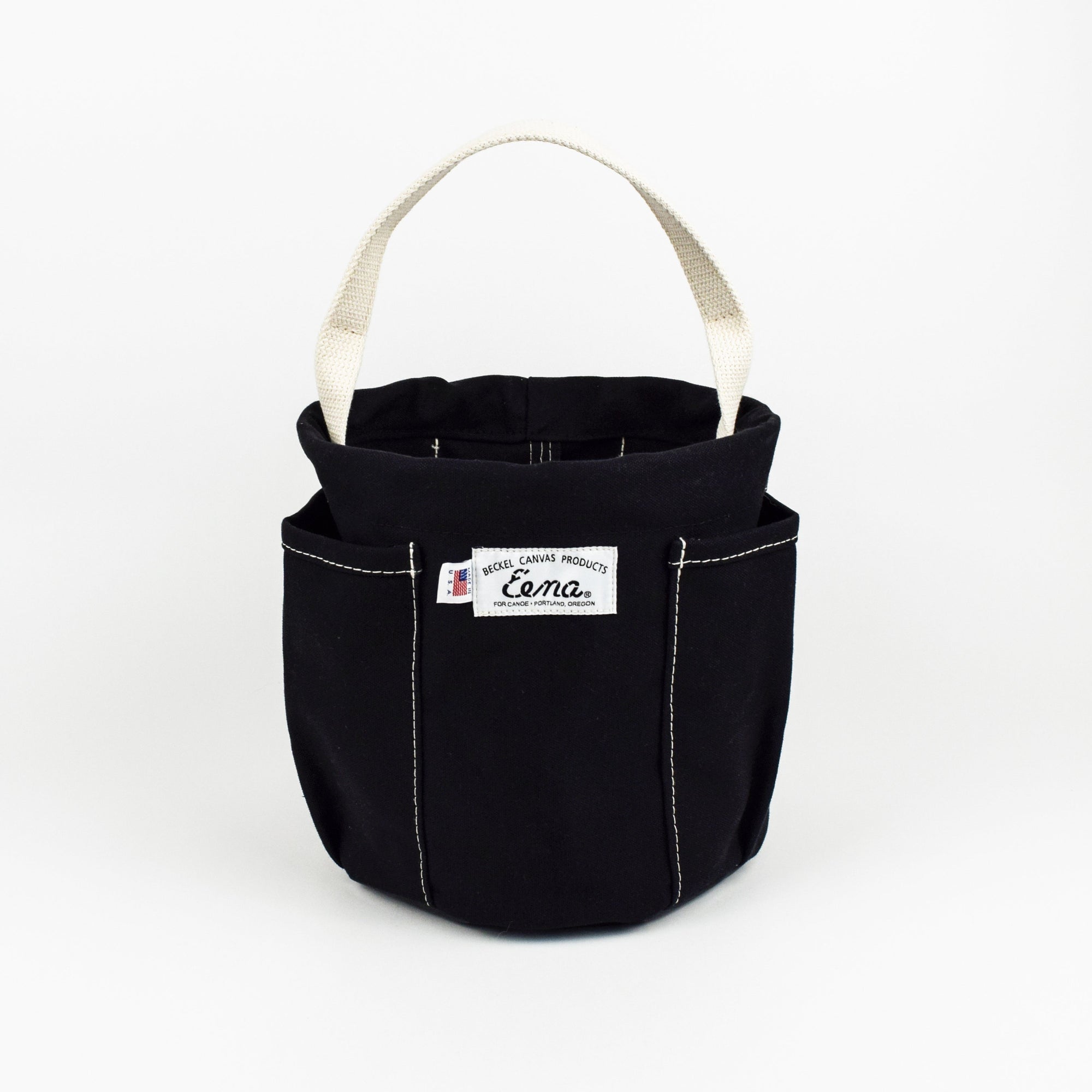 Black canvas bucket with a white handle on a white background