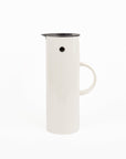 White plastic thermal pitcher with black rim on a white background