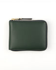 Green wallet with a gold zipper on a white background