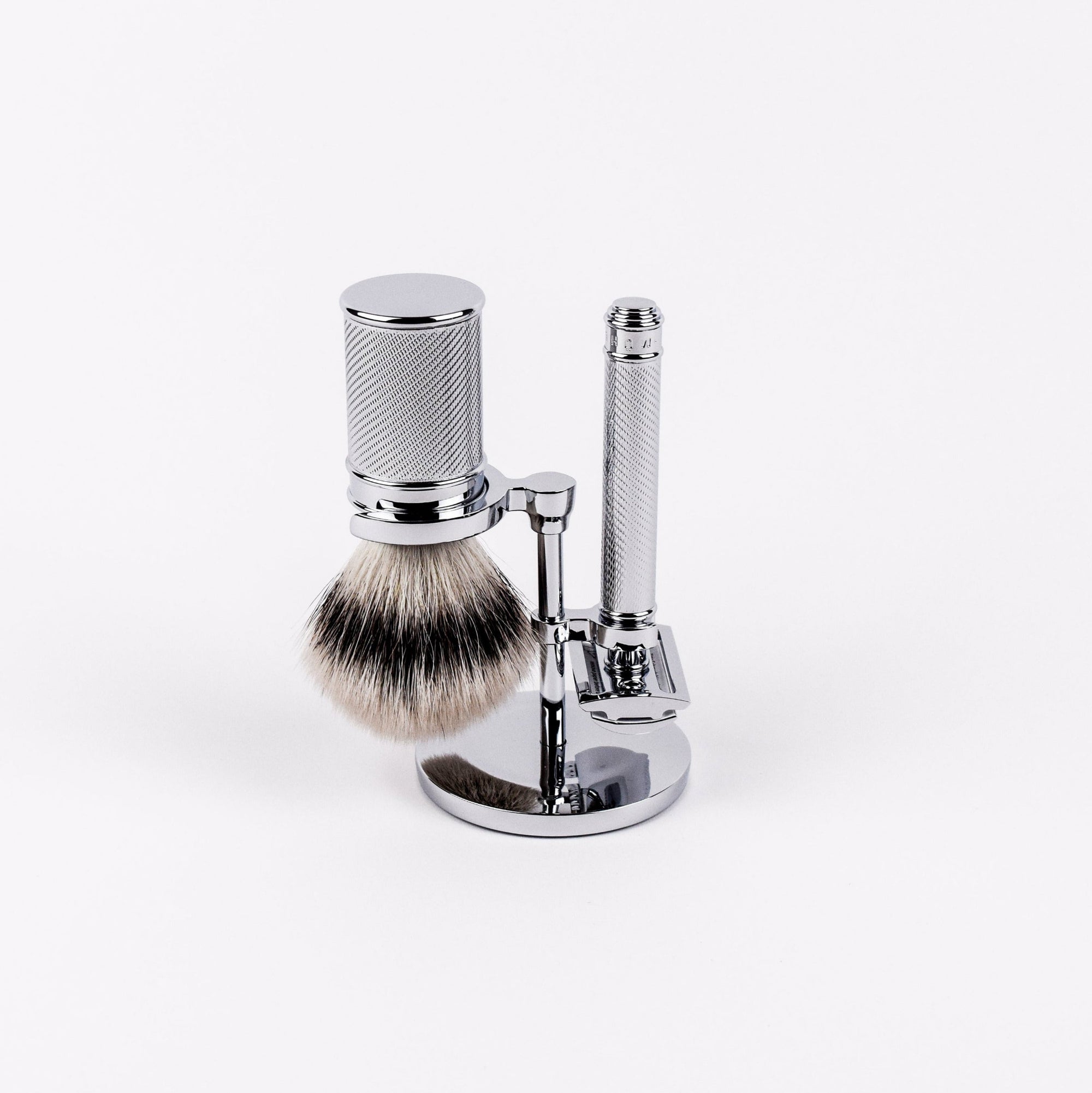Shaving brush with stand and holder on a white background