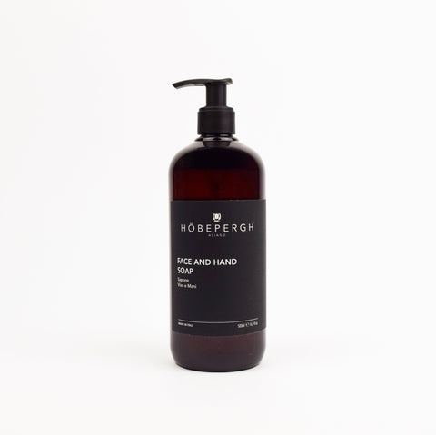 Brown soap bottle with black pump and 'Hobepergh' label on a white background