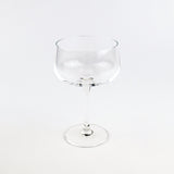 Clear glass cocktail glass on a white background