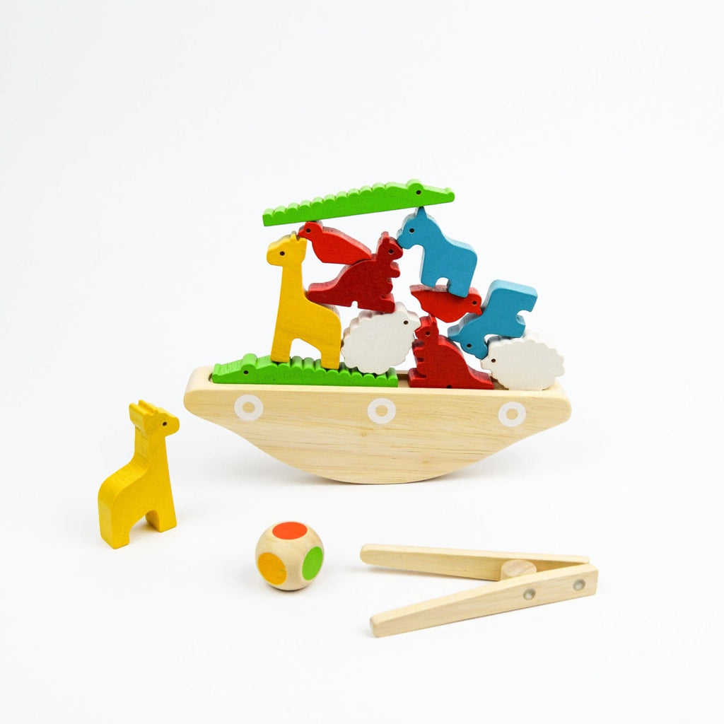 Wooden toy set with animals and a ball on a white background