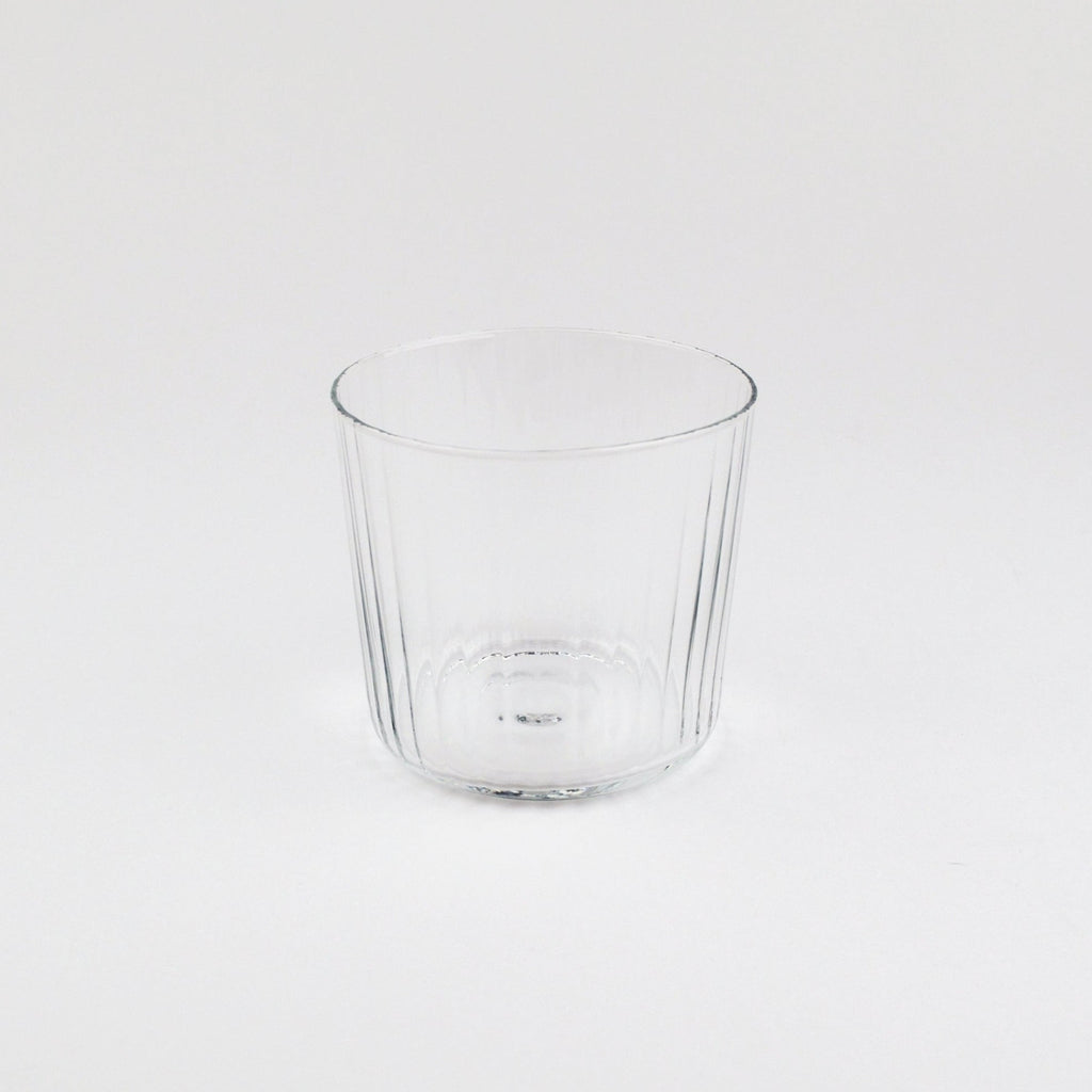 Clear glass tumbler on a white background