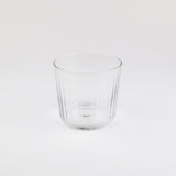 Clear glass tumbler on a white background
