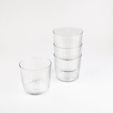 Set of clear glass tumblers on a white background