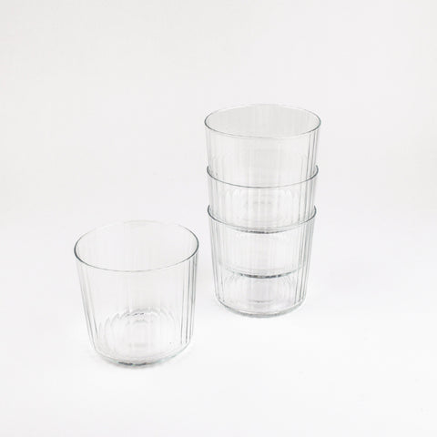 Set of clear glass tumblers on a white background