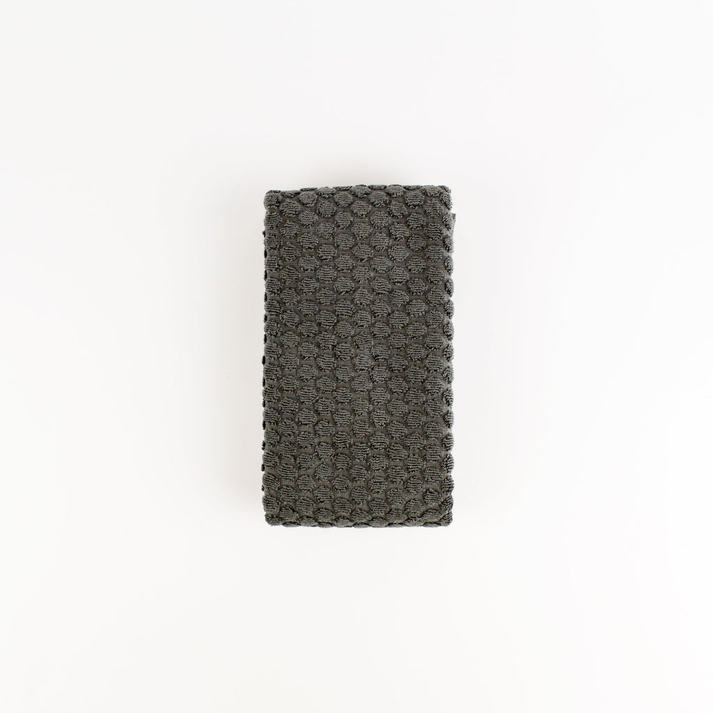 Dark gray textured fabric on a white background