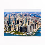 Aerial view of NYC with tall buildings and water bodies