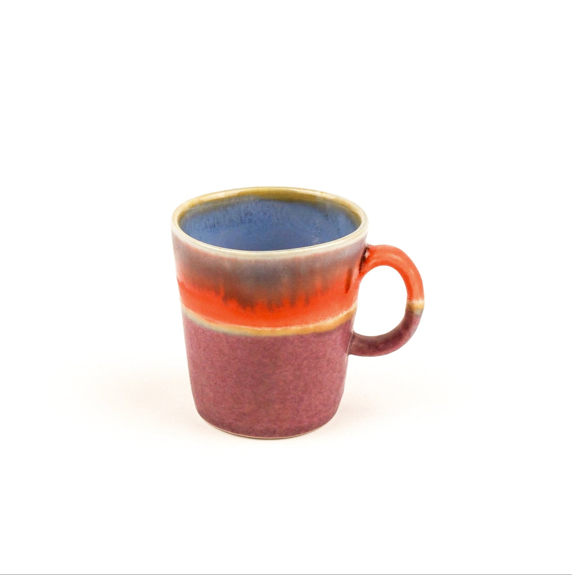 Multicolored mug with a gradient from red to blue on a white background