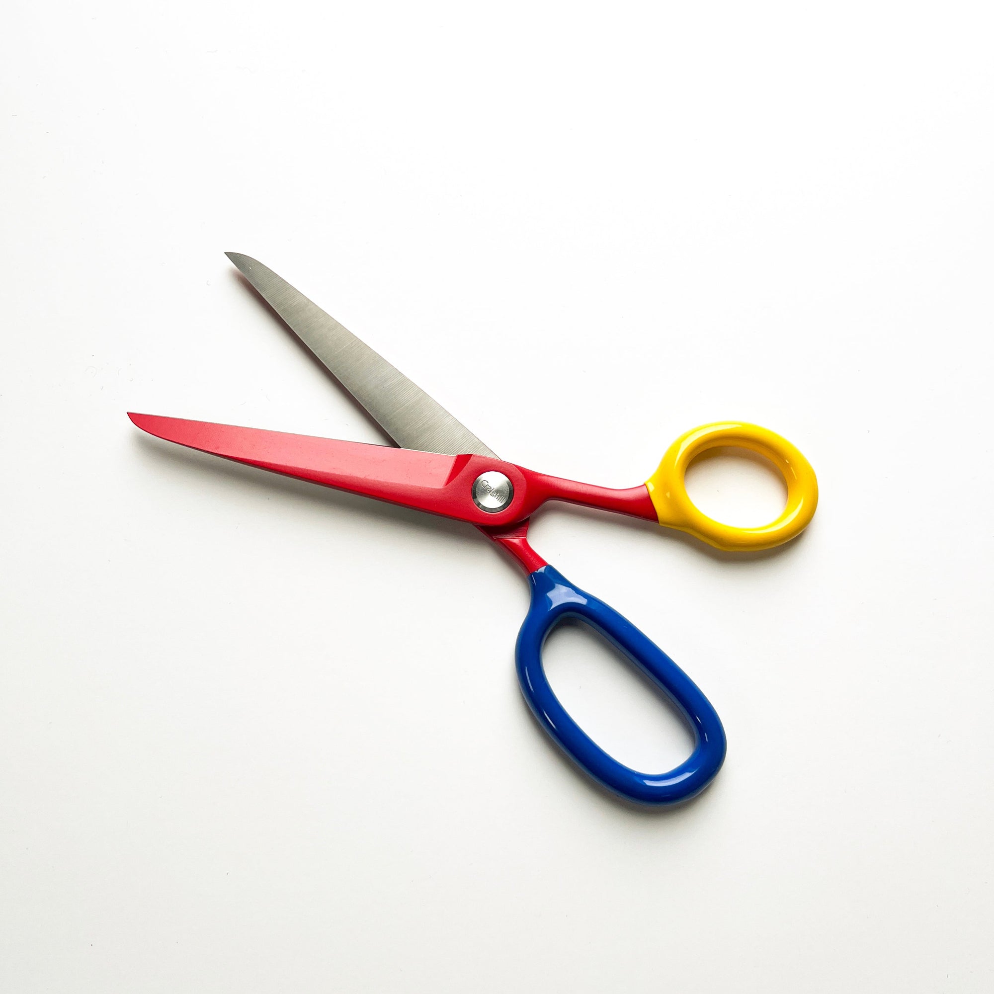 Multicolored scissors on a white background