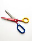Multicolored scissors on a white background