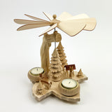 Wooden pyrope with trees and candles on a white background