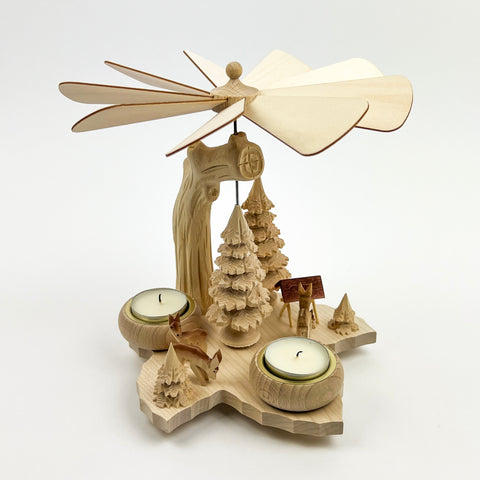 Wooden pyrope with trees and candles on a white background