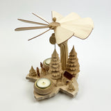 Wooden windmill with a candle on a white background