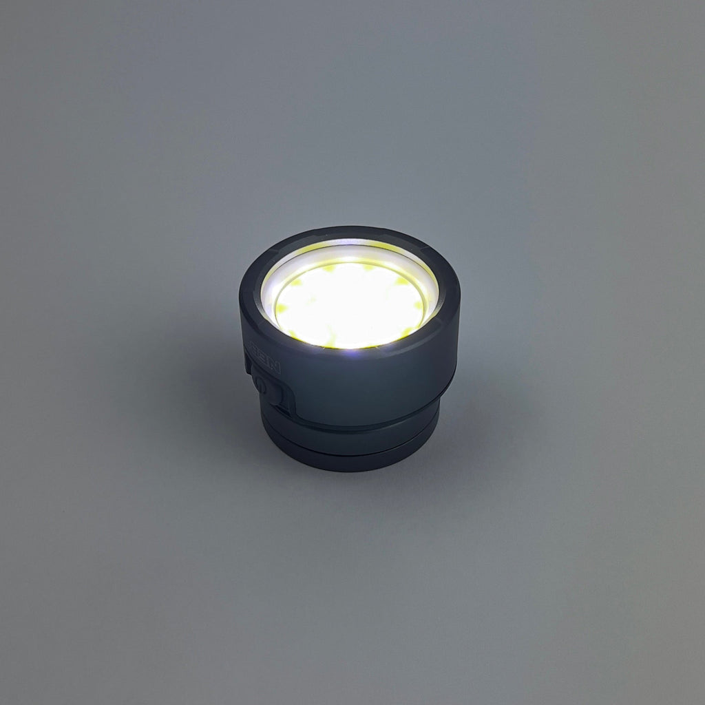 Black LED light bulb on a gray background
