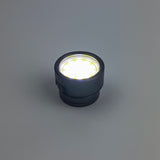 Black LED light bulb on a gray background