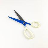Scissors with blue blades and white handles on a white background