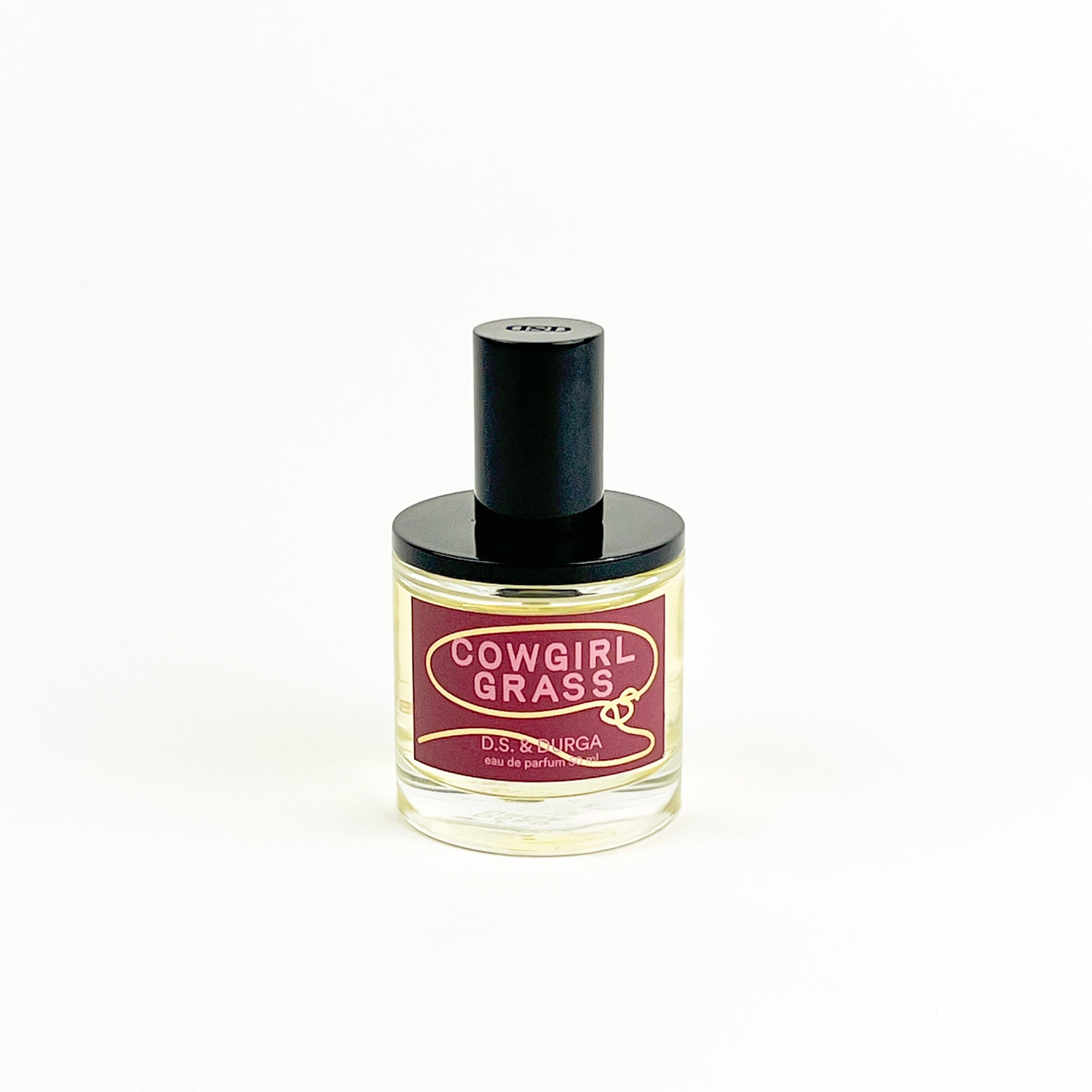 Cowgirl Grass perfume bottle on a white background