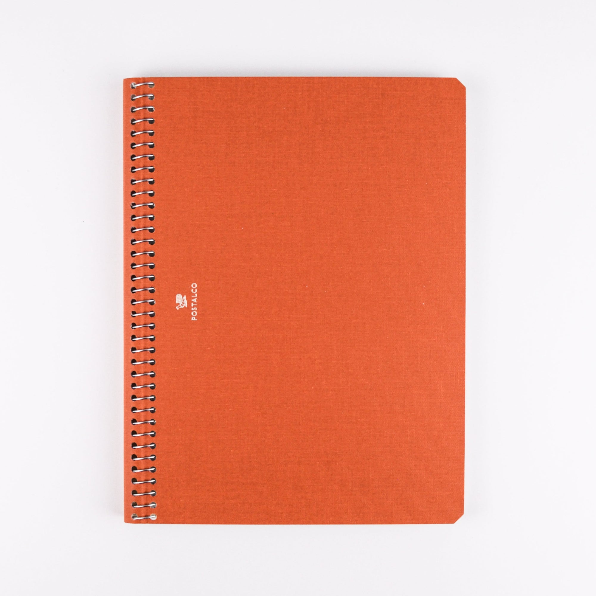 Orange spiral-bound notebook on a white background