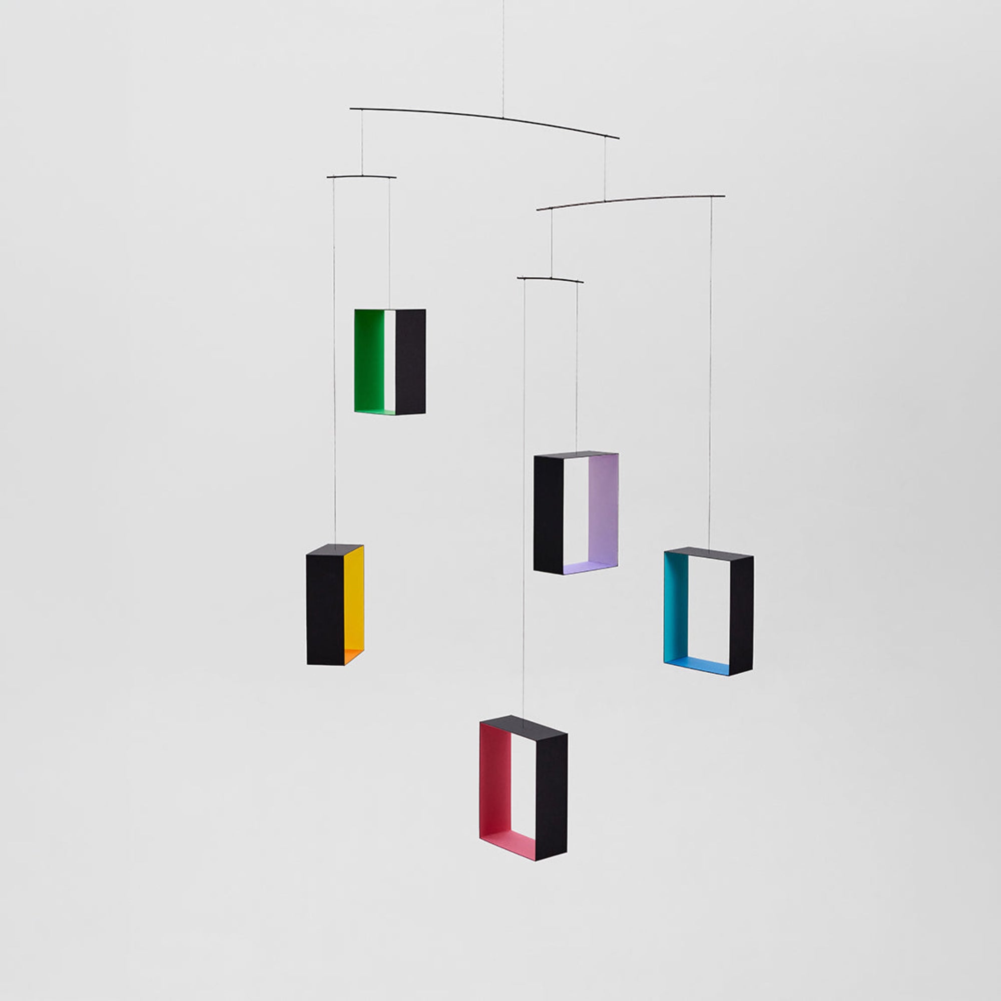 Colorful geometric hanging mobile on a white background