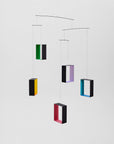 Colorful geometric hanging mobile on a white background