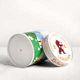 Two cylindrical cookie tins with decorative labels on a white background