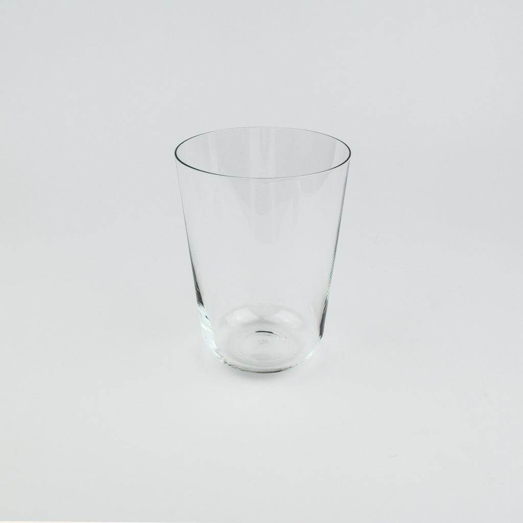 Clear glass tumbler on a light gray background
