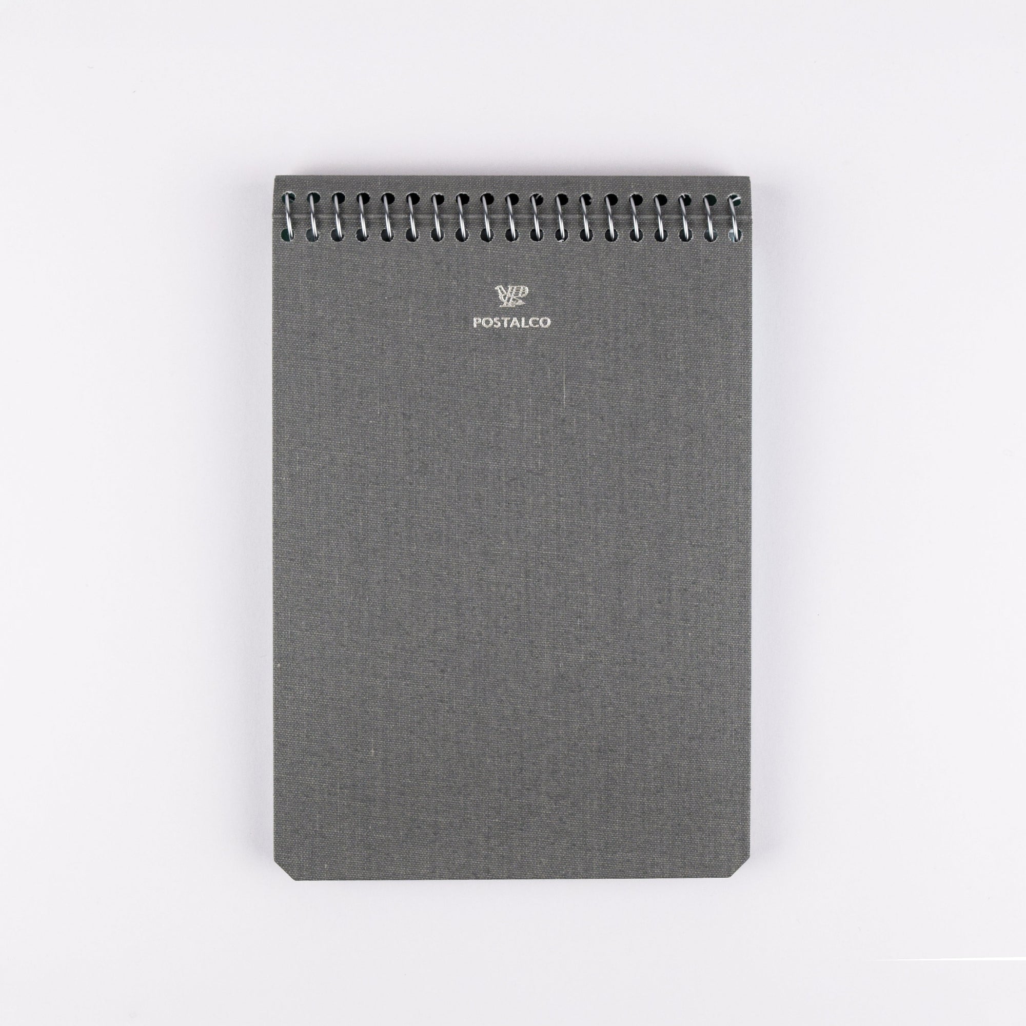 Gray notebook with spiral binding on a white background