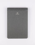 Gray notebook with spiral binding on a white background