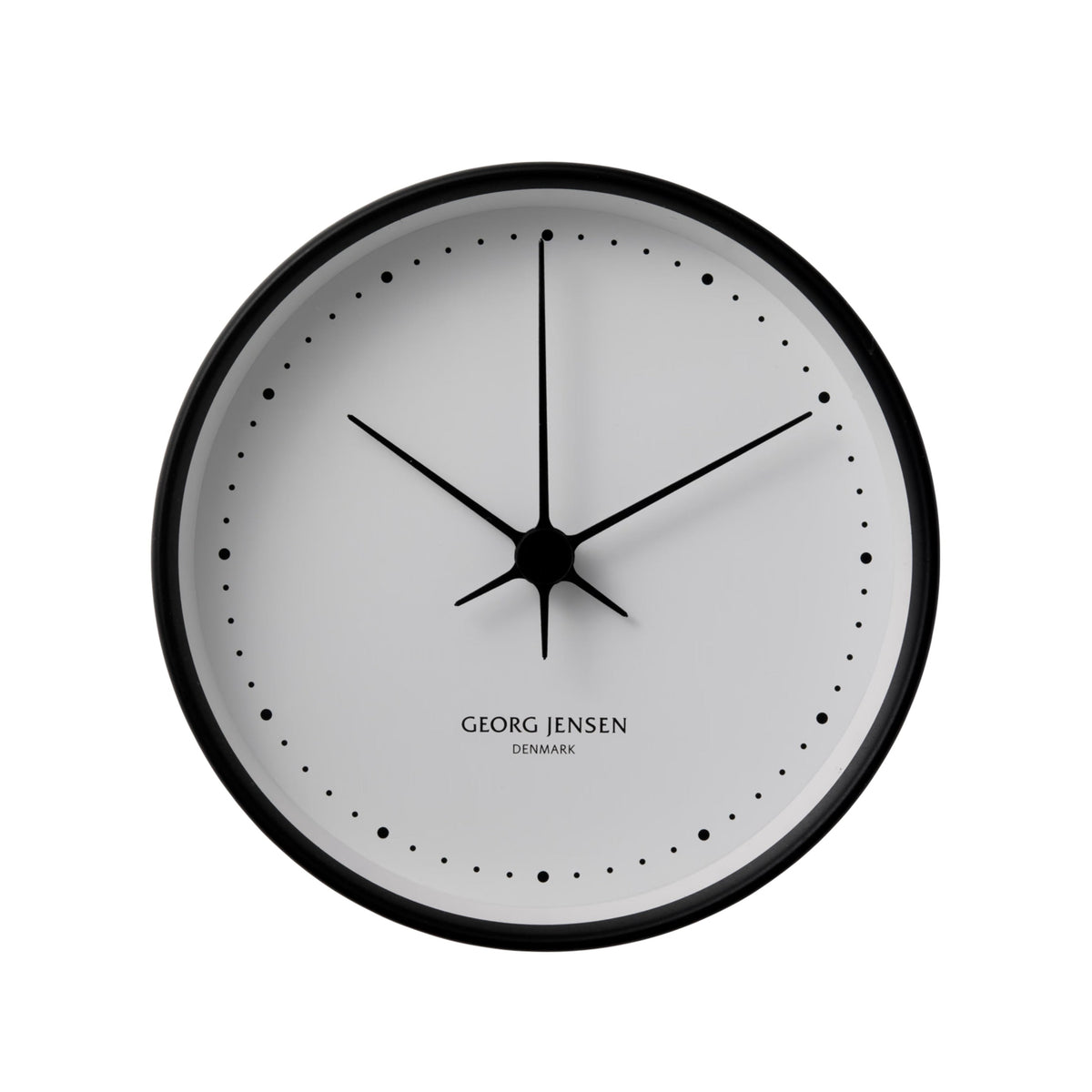 A minimalist round wall clock by Georg Jensen with a black frame, black hands, and a white dial on a clean white background.