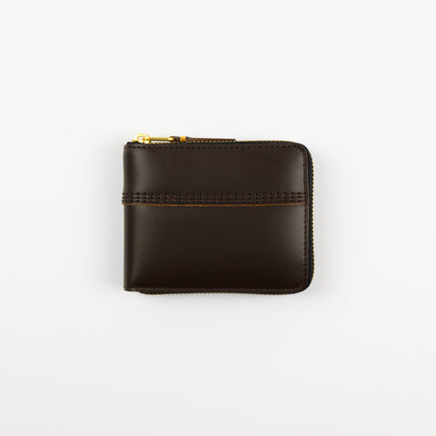 Brown leather wallet with gold zipper on a white background