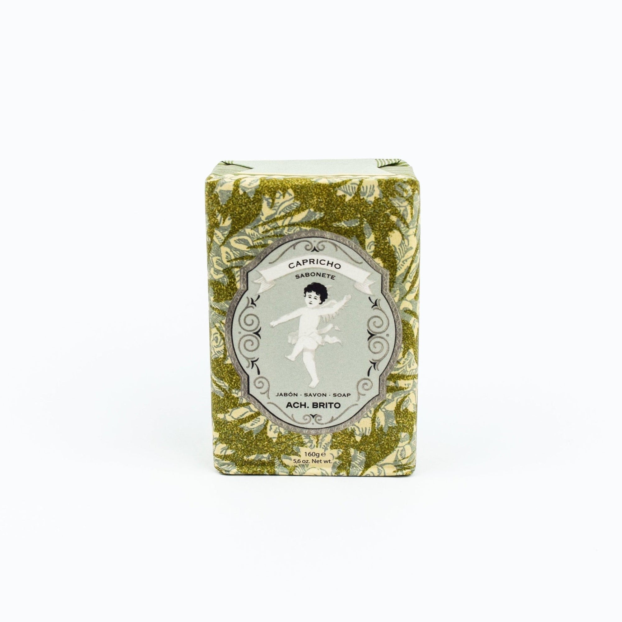 Bar of soap in a decorative box with floral pattern on a white background