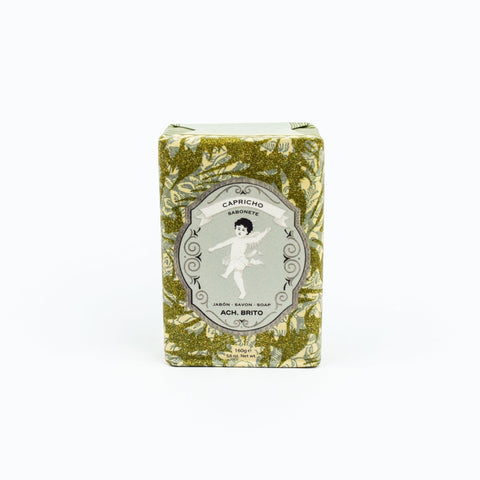 Bar of soap in a decorative box with floral pattern on a white background