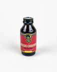 Bottle of Hibiscus Cardamom syrup with a red label on a white background