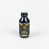 Bottle of Cola syrup on a white background