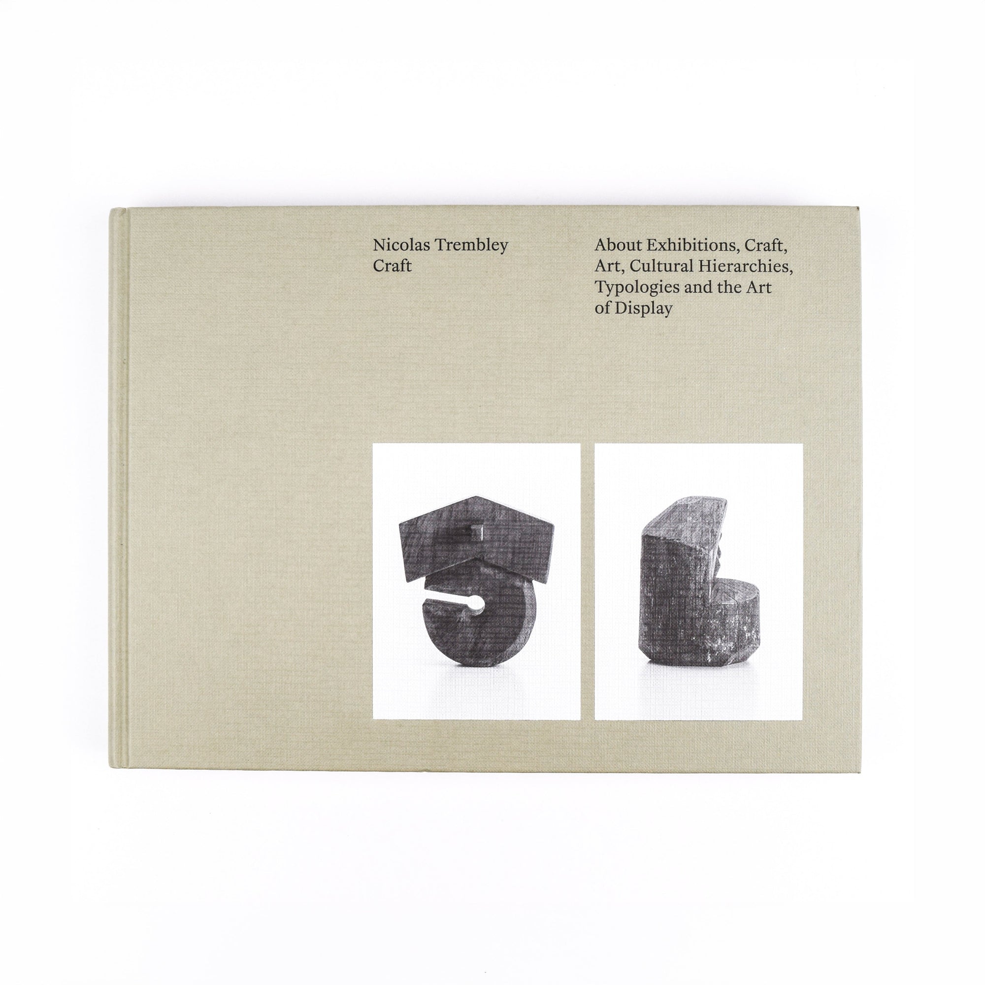 Book cover with text and images of objects on a beige background