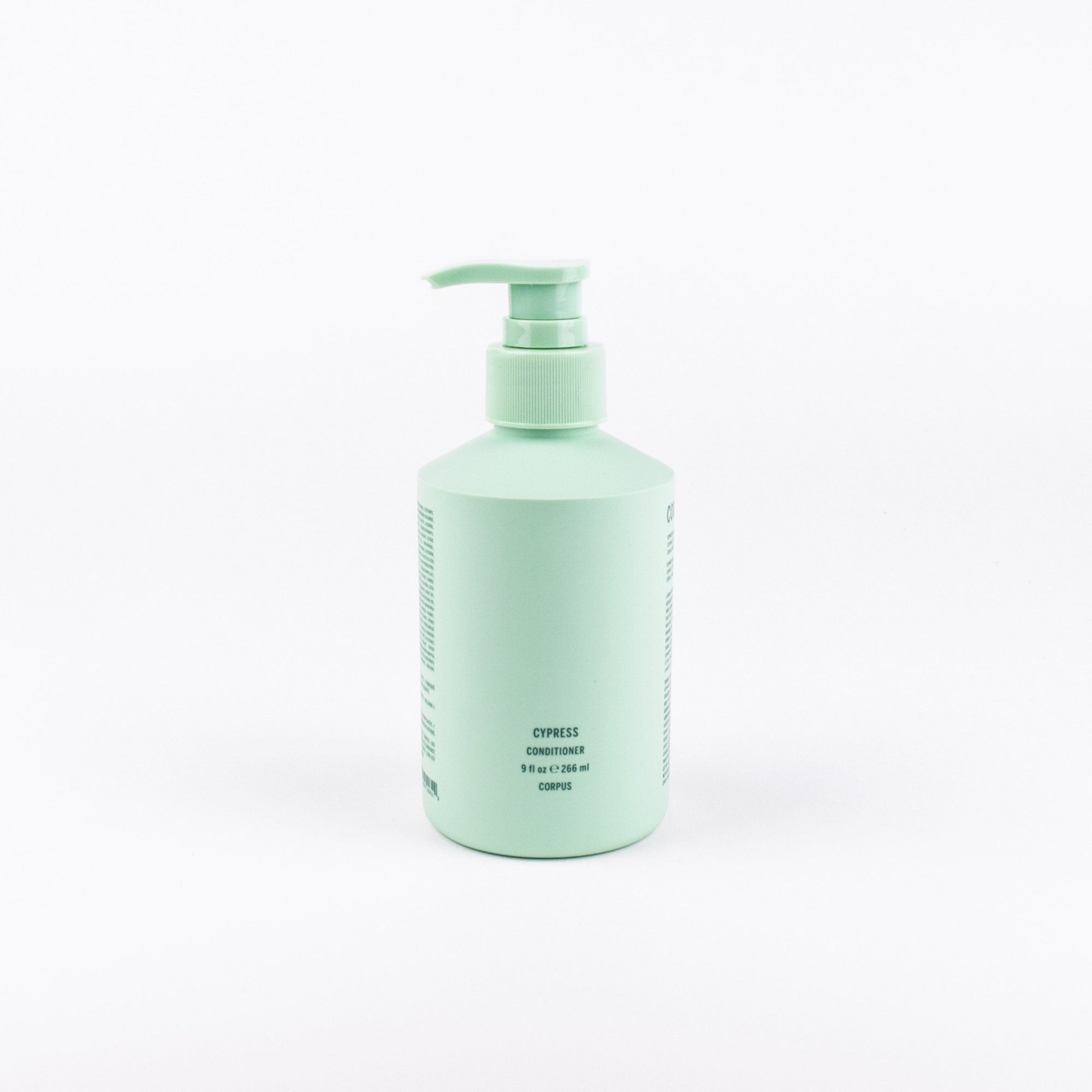 A mint green pump bottle of hair conditioner labeled 'CYPRESS CONDITIONER' on a clean white background.