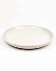 White ceramic plate on a white background