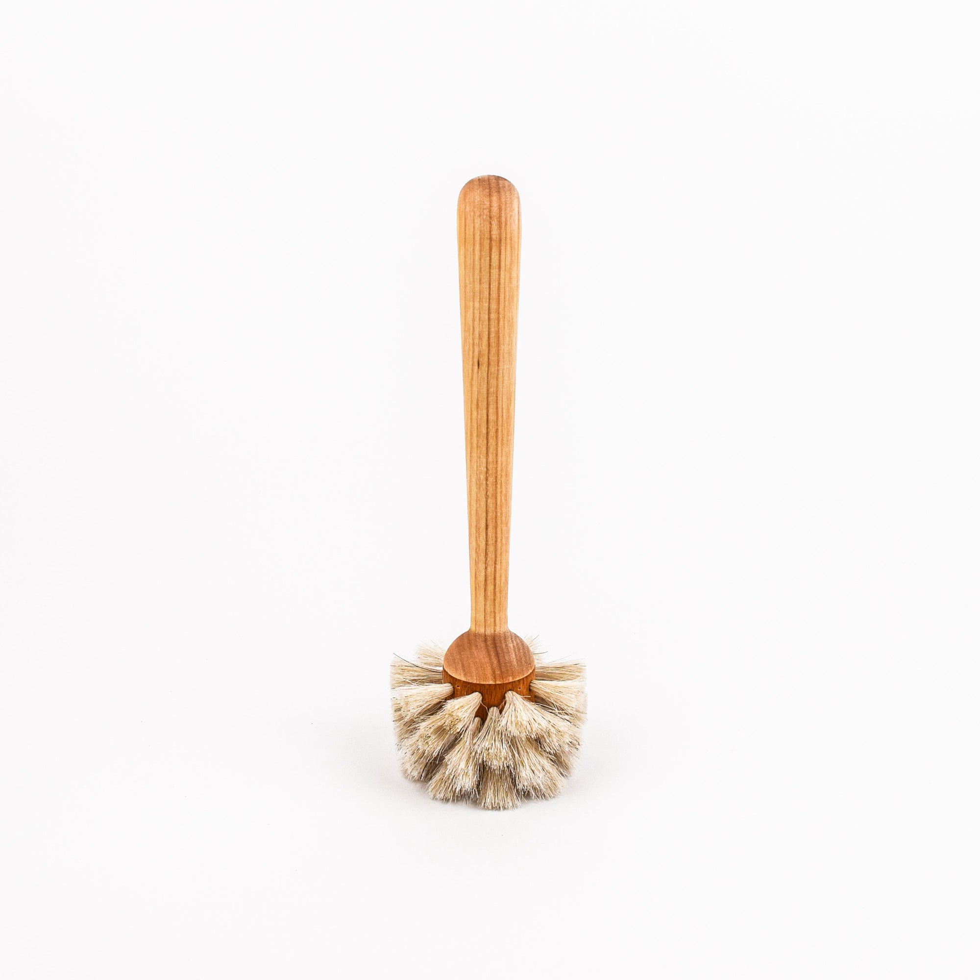 Wooden handled dish brush with natural bristles on a white background